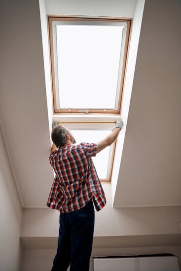 AdobeStock_385943023 Glass window skylight installation in Bozeman Montana